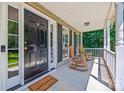 Inviting front porch with rocking chairs, perfect for relaxing outdoors at 1921 Williford Woods Ln, Rock Hill, SC 29730