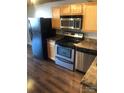 Modern kitchen appliances and wooden cabinets with great counter space at 201 S Hoskins Rd # 328, Charlotte, NC 28208