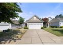 Single-story home featuring low maintenance landscaping and two car garage at 20241 Dovekie Ln, Indian Land, SC 29707
