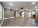 Open-concept living room boasting updated flooring, neutral paint, and ample natural light at 2509 1St St, Statesville, NC 28677