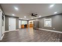 Spacious living room featuring modern gray walls, hardwood floors, and stainless steel appliances at 2509 1St St, Statesville, NC 28677