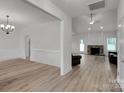 Bright, open-concept living area features a stone fireplace and light wood flooring, creating a cozy atmosphere at 275 Dorothy Dr, China Grove, NC 28023