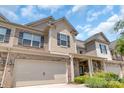 This townhome boasts a two-car garage, brick and siding exterior, and well-maintained landscaping at 3159 Hartson Pointe Dr, Fort Mill, SC 29707