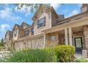 A townhome with a two-car garage, brick and siding exterior, and well-manicured landscaping at 3159 Hartson Pointe Dr, Fort Mill, SC 29707