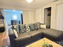 Inviting living room featuring a comfortable sectional sofa with stylish throw pillows at 409 W Norment Ave, Gastonia, NC 28052