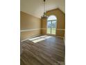 Bright dining room featuring large window and stylish laminate floors at 417 Garret Ln, York, SC 29745