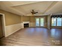 Spacious living room has a cozy fireplace and hardwood style floors at 417 Garret Ln, York, SC 29745