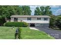 Well-kept home with a mailbox, lush lawn, and convenient drive-under garage at 4278 Harbor Ln, Sherrills Ford, NC 28673