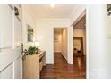 Bright foyer with hardwood floors, a console table, and views into other rooms at 5301 Addison Dr, Charlotte, NC 28211