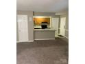 Open-concept living space seamlessly connects the living room and the kitchen at 6260 Rosecroft Dr, Charlotte, NC 28215
