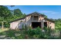 View of the barn with two entrances and a side lean-to structure, perfect for various outdoor needs at 6314 Providence Church Rd, Vale, NC 28168