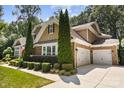 Beautiful home with well-kept lawn, two car garage, and lush landscaping at 7327 Snowbird Ct, Mint Hill, NC 28227