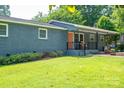Charming single-story home with a well-maintained lawn, inviting walkway, and quaint front porch at 108 Graham St, Stanley, NC 28164