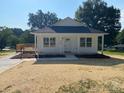 Charming single-story home with a well-maintained lawn and a welcoming front porch at 1103 Adams St, Statesville, NC 28677