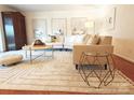 Comfortable living room featuring modern furnishings, hardwood floors, and lots of light at 1323 Queens Rd # 327, Charlotte, NC 28207