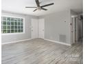 Bright living room featuring gray walls, tile flooring and large window at 1655 Woodhaven Rd, Rock Hill, SC 29732