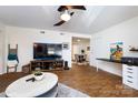 Open-concept living room with a TV and a connection to the dining area at 2620 Park Rd # F, Charlotte, NC 28209