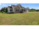 Charming home with stone accents, covered porch, attached garage and large lawn at 307 Nc Hwy 49 S Hwy, Richfield, NC 28137
