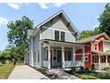 Charming two-story home with a welcoming front porch and landscaped yard at 419 Solomon St, Charlotte, NC 28216