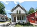 Charming two-story home with a welcoming front porch and landscaped yard at 419 Solomon St, Charlotte, NC 28216