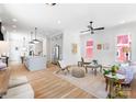 Bright living room featuring hardwood floors and an open floor plan at 419 Solomon St, Charlotte, NC 28216