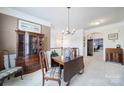 Lovely dining room featuring a chandelier and a view to the living room at 44424 Oriole Dr # 200, Indian Land, SC 29707