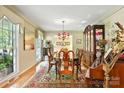 Formal dining room showcasing hardwood floors, elegant chandelier, and classic furniture at 701 4Th Ne Ave, Conover, NC 28613