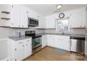 Bright kitchen features white cabinets, stainless steel appliances, and a modern countertop at 1140 Mckinnon Dr, Rock Hill, SC 29732