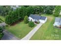 An aerial view of a home surrounded by green trees in a well-maintained landscape at 1265 39Th Street Cir, Hickory, NC 28602