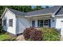 Home's inviting entry with dark shutters and a small porch at 1265 39Th Street Cir, Hickory, NC 28602