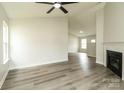 Bright living room with luxury vinyl plank flooring, fireplace, and ample natural light at 1628 Sandpiper Dr, Rock Hill, SC 29732