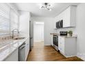 Beautifully renovated kitchen with stainless appliances, granite countertops, and modern finishes at 2488 Catawba Church Rd, Rock Hill, SC 29730