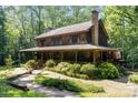 Beautiful two-story home with a welcoming front porch and lush landscaping at 2615 Highway 557 None, Clover, SC 29710