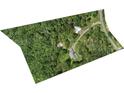 An aerial view of a secluded home and surrounding property with mature trees and long driveway at 265 River Run Rd, Statesville, NC 28625