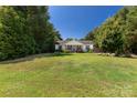 Well-maintained home with a spacious front yard and mature trees at 4030 Orion Rd, York, SC 29745