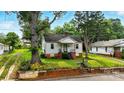 Charming single Gathering home with a cozy front porch and inviting curb appeal at 450 1St Se St, Hickory, NC 28602