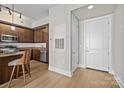 Entryway of home featuring small kitchen with stainless steel appliances and granite counters at 4625 Piedmont Row Dr, Charlotte, NC 28210