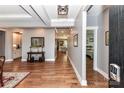 Elegant entryway boasting hardwood floors, tray ceilings, and an open view into the living spaces at 5129 Devonshire Rd, Denver, NC 28037