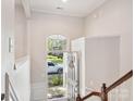 Bright foyer with stairs, a coat closet, and an arched window above the front door at 570 Sixth Baxter Xing # 16, Fort Mill, SC 29708