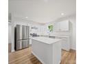 Modern kitchen with stainless steel appliances, a large island with quartz countertop, and ample storage, designed for convenience at 821 1St St, Kings Mountain, NC 28086