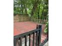 Enclosed wood deck surrounded by greenery and mature trees offering a private outdoor retreat at 101 Treeline Dr, Belmont, NC 28012
