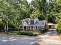 Lovely two-story home showcasing a fenced yard and detached garage with driveway at 101 Treeline Dr, Belmont, NC 28012