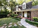 Inviting front entrance with a walkway and lush plantings at 101 Treeline Dr, Belmont, NC 28012