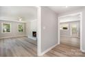Open-concept living area with wood floors, fireplace, and abundant natural light at 1138 Laurel St, Salisbury, NC 28144