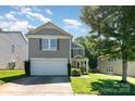 Charming two-story home with a two-car garage, complemented by a beautifully maintained lawn and landscaping at 1432 Matthew Allen Cir, Kannapolis, NC 28081