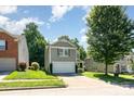View of a charming two-story home with attached garage, nestled in a serene suburban neighborhood at 1432 Matthew Allen Cir, Kannapolis, NC 28081
