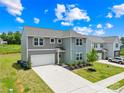 Beautiful two-story home featuring manicured lawn, attached garage, and welcoming front entrance at 2512 Andes Dr, Statesville, NC 28625