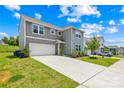 Attractive two-story home featuring a well-maintained lawn, attached garage, and welcoming front entrance at 2512 Andes Dr, Statesville, NC 28625