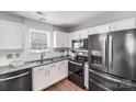 Modern kitchen featuring stainless steel appliances and sleek granite countertops at 5116 Crane Point Dr, Charlotte, NC 28227