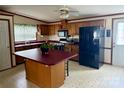 Functional kitchen with wood cabinetry, a center island, and modern appliances at 5816 Scotland Yard Rd, Rock Hill, SC 29732